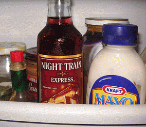1987 Suzuki Samurai - Condiments stored in a refrigerator, including salad dressing and mayonnaise bottles.
