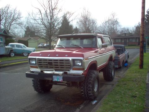 1992 Ford Bronco - This lifted Ford Bronco has oversized tires and is parked on a residential street.