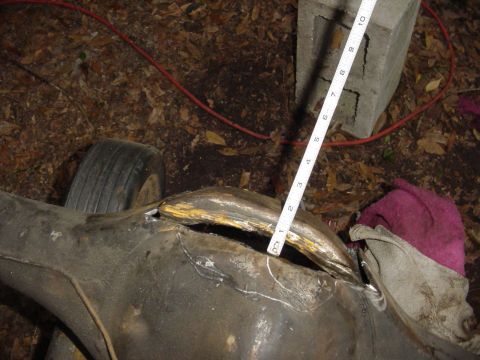 1989 Ford Bronco - Measuring the opening on a modified rear axle housing. No vehicle is visible.