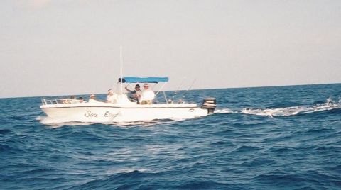 1995 Ford Bronco - The Sea Eagle boat cruises on the ocean with several passengers.