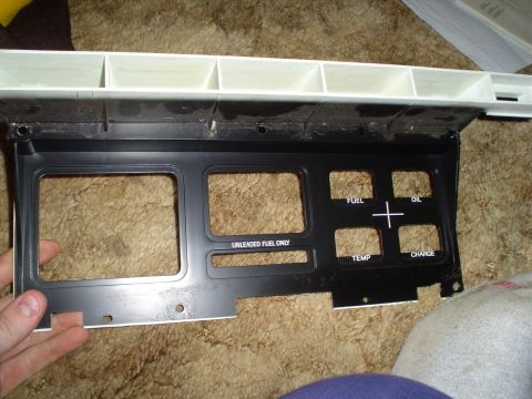 1984 Ford Bronco - This dashboard gauge cluster shows indicators for fuel, oil, temperature, and charge, with a "UNLEADED FUEL ONLY" label.
