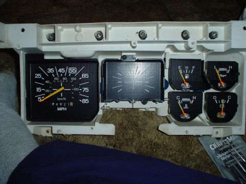1984 Ford Bronco - Dashboard gauges from a 1984 Ford Bronco, including speedometer, fuel, oil, and temperature indicators.