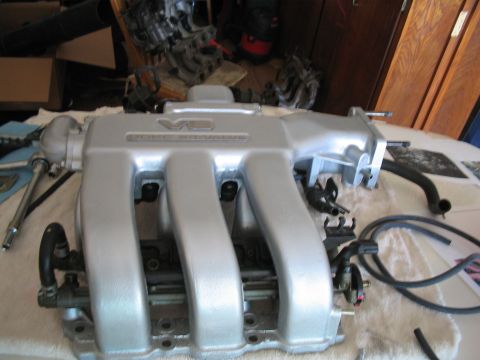 1995 Ford Probe - A V6 DOHC intake manifold is shown, with various hoses and connectors.