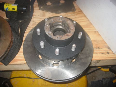 1989 Ford Bronco - Put the rotor on the hub, painted the previous day. Sandblasted the lug studs and reused them.
