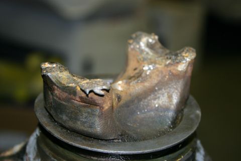 2003 Jeep TJ - This severely damaged metal part shows significant wear and breakage.