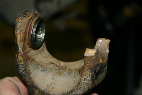 2003 Jeep TJ - A close-up view of a corroded axle component, showing stamped identification numbers.