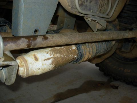 1995 Ford Bronco - Close-up of the undercarriage shows a worn shock absorber and tie rod, with a SuperMotors.net watermark visible.