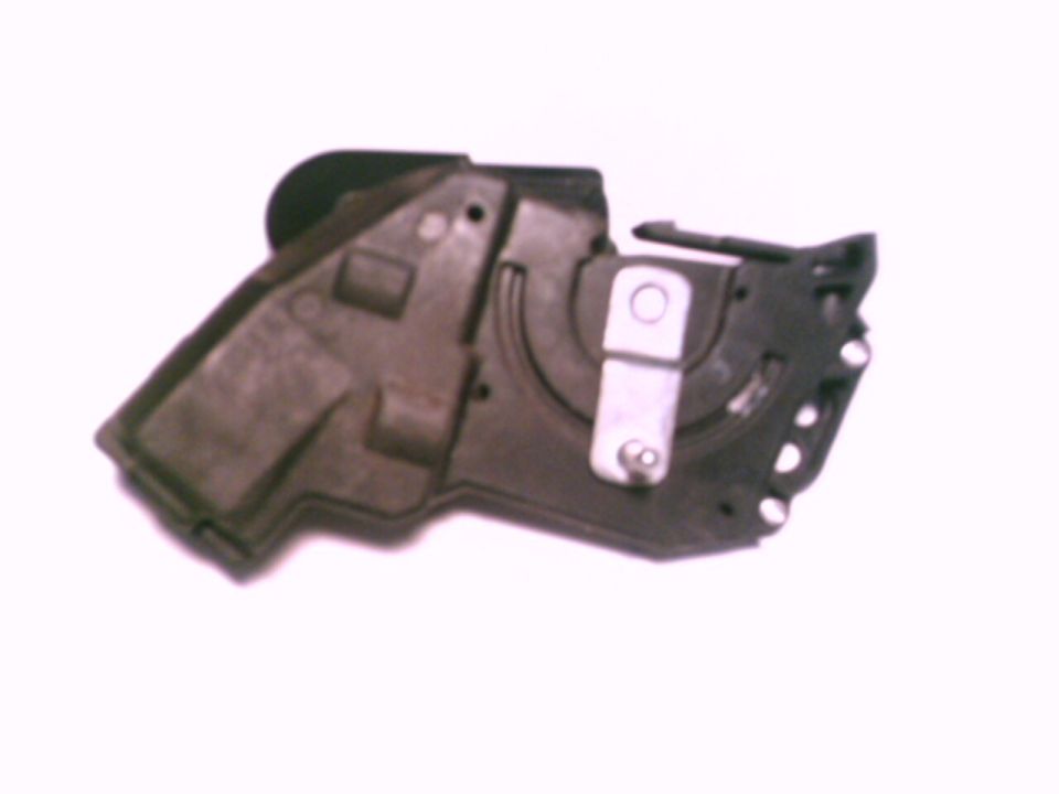 Black plastic housing with curved channel and metal bracket, automotive component on white background