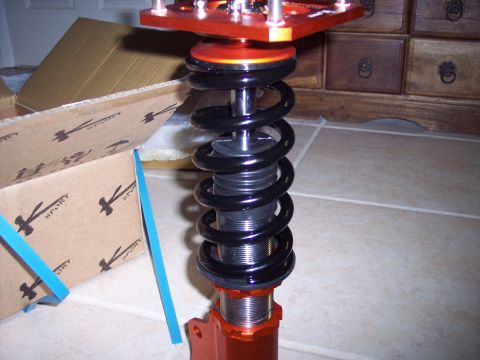 1995 Ford Probe - Close-up of an adjustable coilover suspension part, likely for aftermarket use.