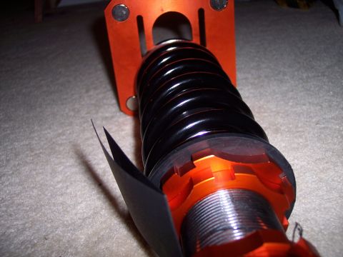 1995 Ford Probe - Close-up of an aftermarket coilover suspension component, likely for performance tuning.