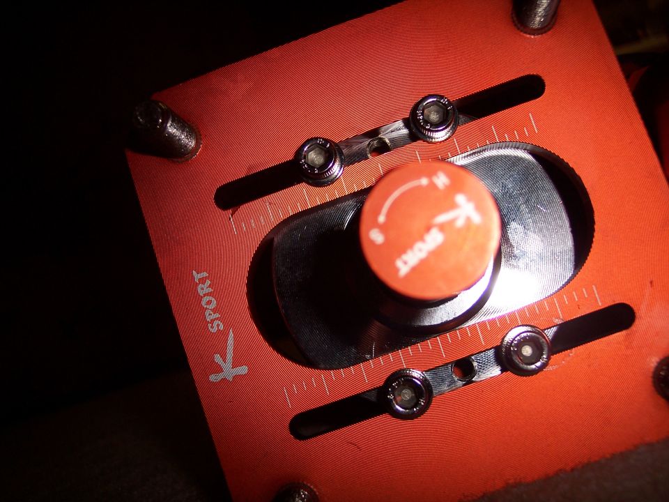 K Sport adjustable suspension component with orange knob and measurement markings