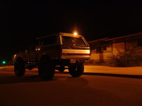 1989 Ford Bronco - Rear view of a 1989 Ford Bronco at night.