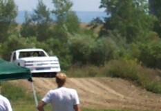 1979 Ford F-150 - A white pickup truck navigates a dirt incline outdoors.