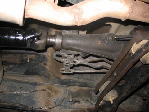 1981 Ford Bronco - Underside view of a vehicle's driveshaft and exhaust system.