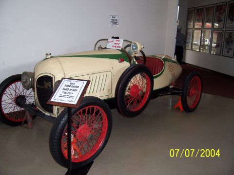 1987 Ford Bronco - This 1910 Ford Racer, which competed at Indy, is displayed with a descriptive plaque.