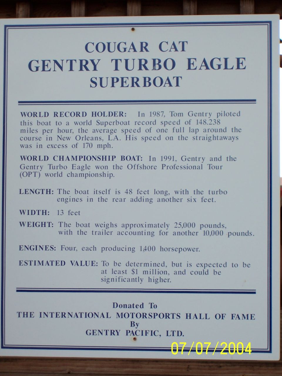 Sign about the Cougar Cat Gentry Turbo Eagle Superboat, detailing its world record and championship wins