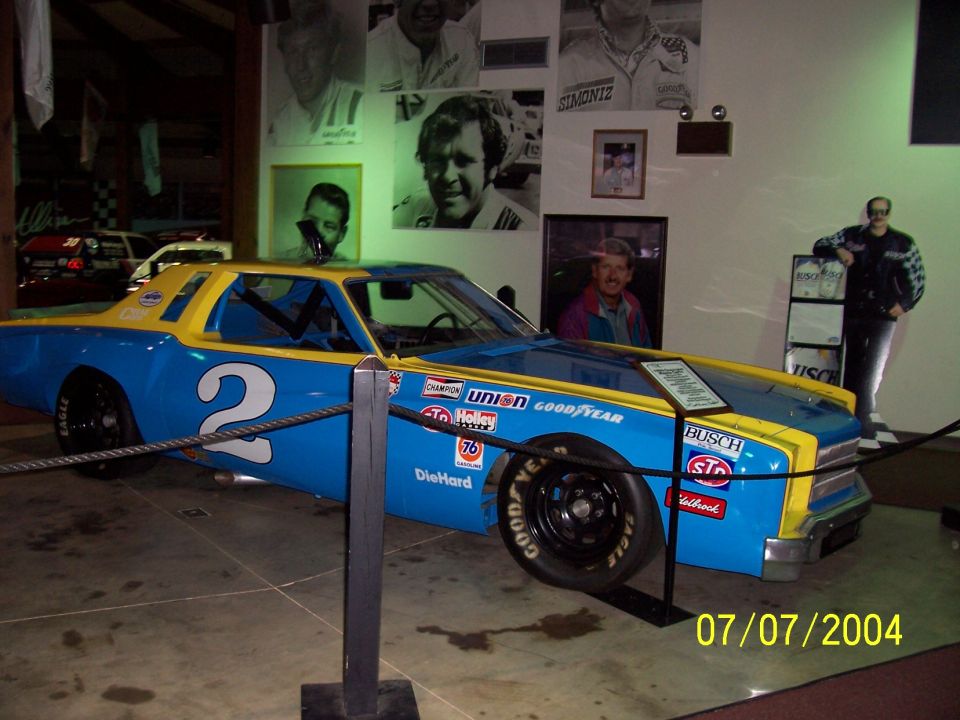 Blue and yellow race car with number 2 and various sponsor decals