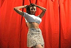 1979 Ford F-150 - A woman poses for a photo against a red curtain background.