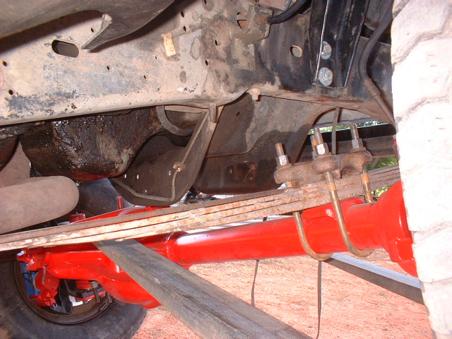 1986 Ford F-250 rear axle and leaf spring suspension, painted red