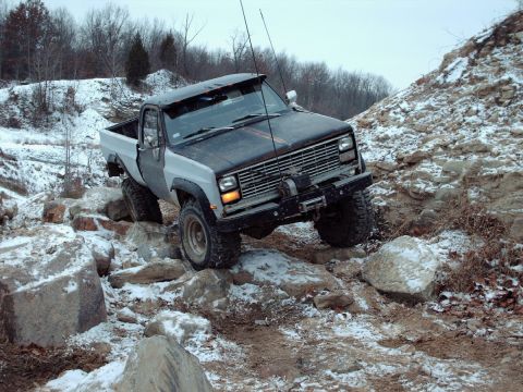 1977 Ford F-150 - This truck is tackling a challenging off-road course in snowy conditions.