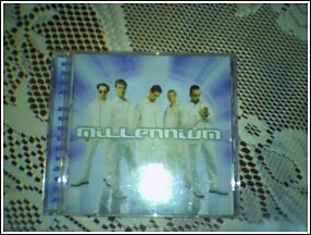 1993 Ford Bronco - Millennium CD case five men in white outfits against a blue background.