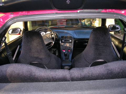 1996 Ford Probe - The interior of a 1996 Ford Probe, its dashboard, steering wheel, and front seats.