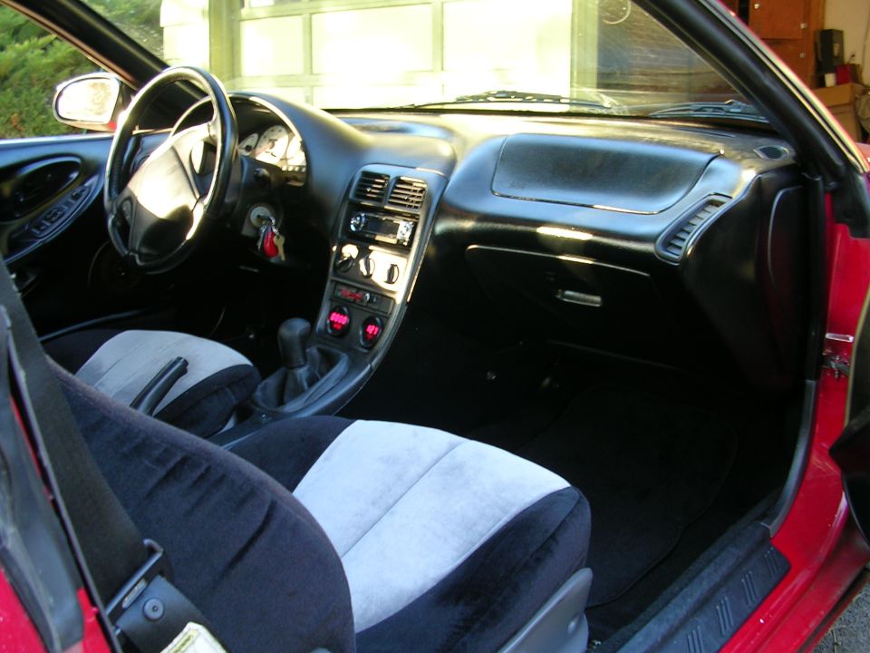 1996 Ford Probe interior showing dashboard, steering wheel, seats, and center console