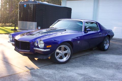 1970 Chevrolet Camaro - A 1970 Chevrolet Camaro SS in a deep purple finish is shown from a three-quarter front angle.