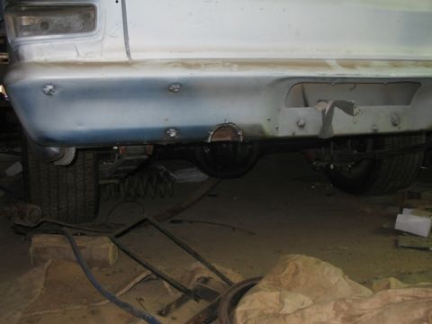 1981 Ford Bronco - The rear of a vehicle is shown with modifications to the bumper and exhaust system.
