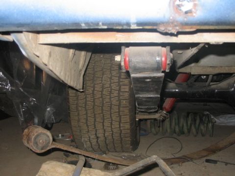 1981 Ford Bronco - Underneath view of a vehicle's rear suspension system, showing modified components.