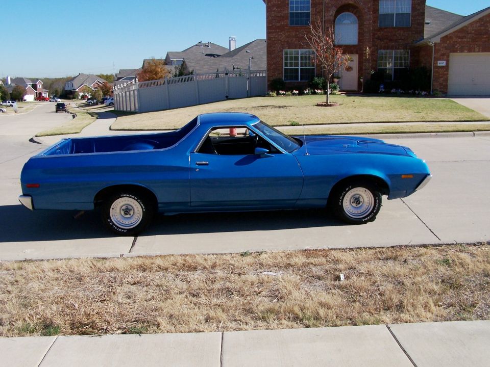Blue 1972 Ford Ranchero parked on a residential street