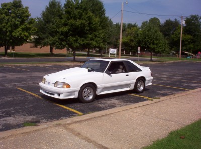 1992 Ford Bronco - This white coupe is parked in a lot. The page claims it is a 1992 Ford Bronco, but it is not.