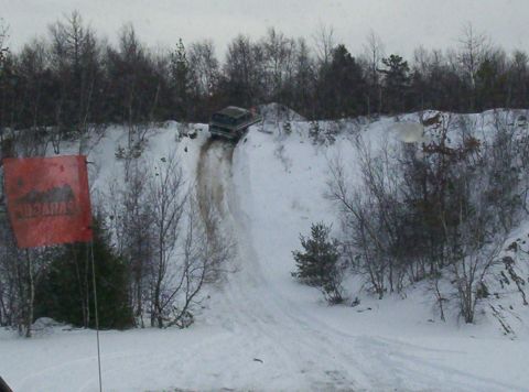 1996 Ford Bronco - Bronco navigating a challenging snowy incline.