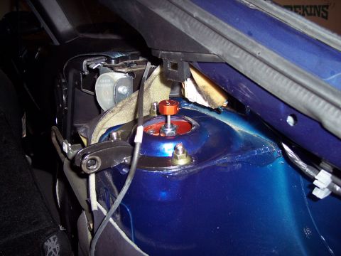 1995 Ford Probe - Adjustable coilover installed on the strut tower of a blue 1995 Ford Probe.