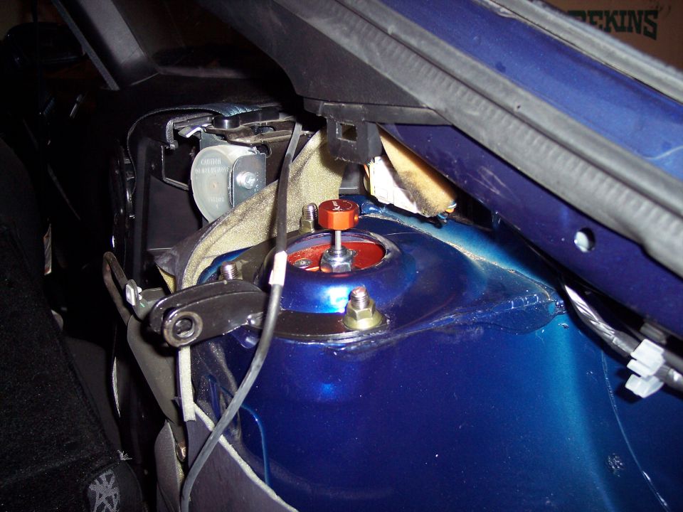 Blue 1995 Ford Probe strut tower with orange adjustable coilover