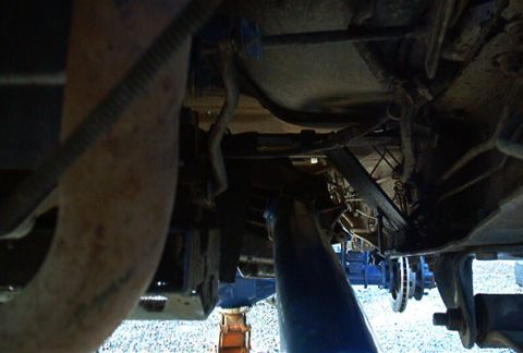 1986 Ford Bronco - Underside view showing the transmission and exhaust components of a vehicle.