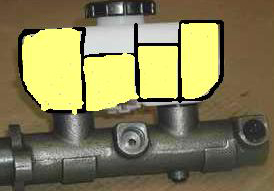 1989 Ford Bronco - A close-up view of a brake master cylinder component.
