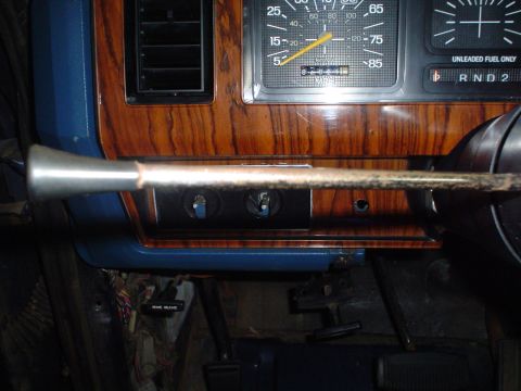 1984 Ford Bronco - Interior view of a 1984 Ford Bronco dashboard, wood grain trim and instrument cluster.