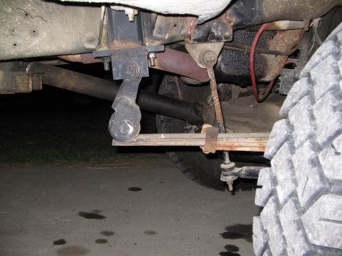 1986 Ford F-350 - Close-up view of the leaf spring suspension system on a 1986 Ford F-350 truck.