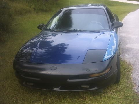 1994 Ford Probe - This car has a two-tone paint job with a blue body and a black front bumper and hood.