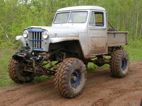 1977 Ford F-150 - This heavily modified pickup truck is equipped for off-road use with large tires and a lifted suspension.
