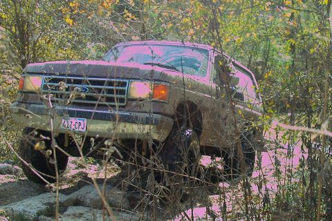 1987 Ford Bronco - This 1987 Ford Bronco is navigating a rocky, wooded trail.