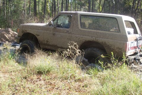 1987 Ford Bronco - This 1987 Ford Bronco is deep in the mud during an off-road excursion.