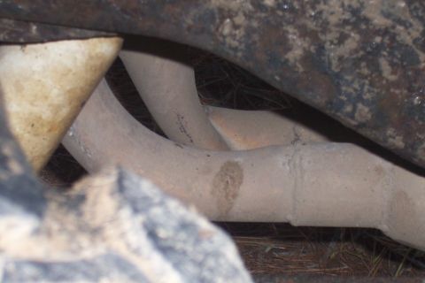 1987 Ford Bronco - Exhaust manifold pipes are visible in this close-up shot.