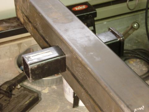1991 Ford Bronco - Close-up of metal hitch receiver and square tubing, with SUPERMOTORS text visible.