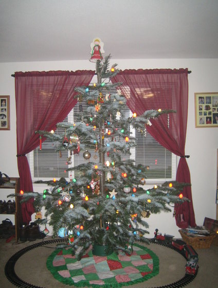 1990 Ford Bronco - A decorated Christmas tree with a model train circling its base.