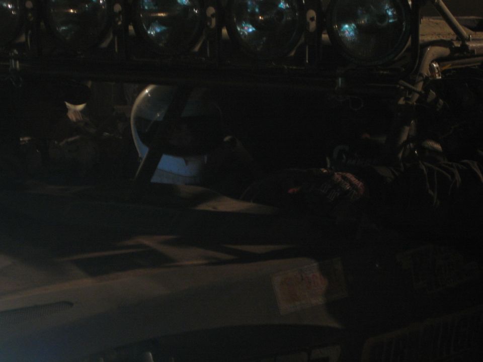 Dark close-up of an off-road vehicle's roof light bar with skull-pattern lamps