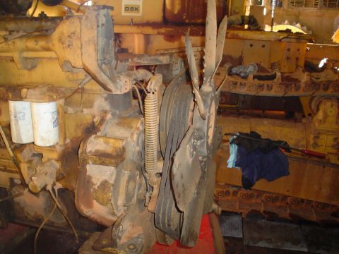 1966 International School Bus - Engine and fan assembly with oil filters, part of a larger machine.