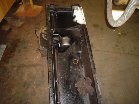 1966 International School Bus - This is a close-up view of an engine oil pan, likely removed for maintenance or repair.