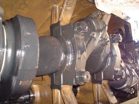 1966 International School Bus - Close-up of engine crankshaft and connecting rods, showing mechanical components.
